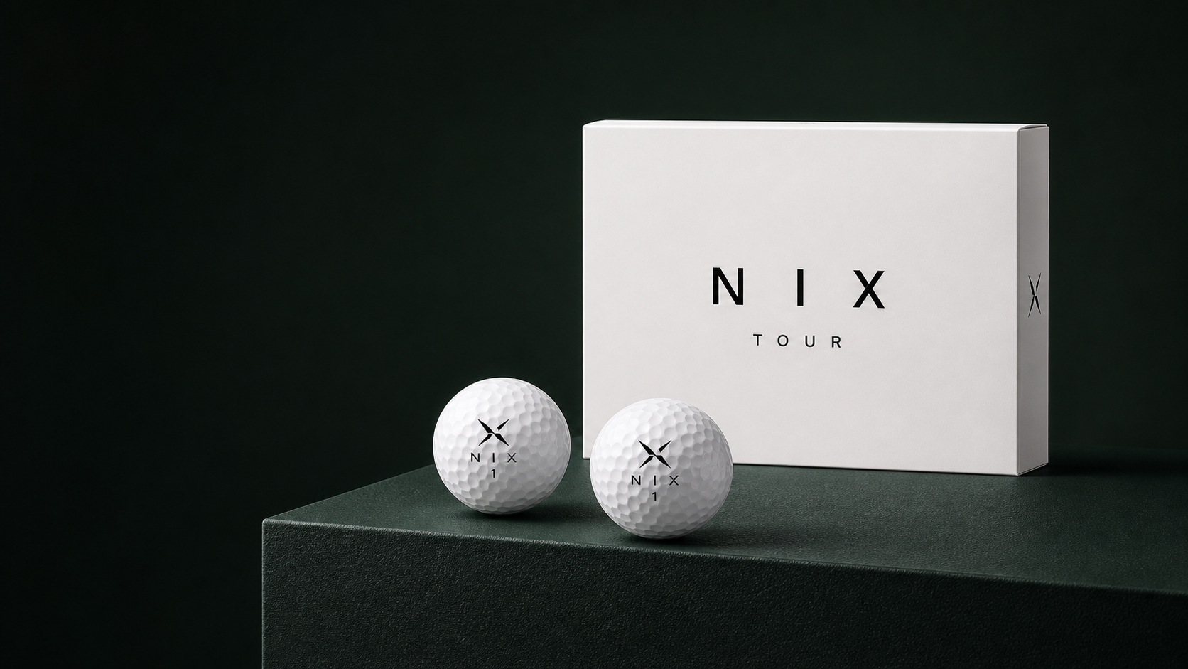 NIX Tour golf balls and white product box on a forest-green plinth
